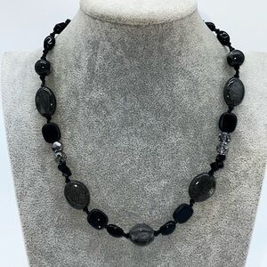 Striking Black and Silver Necklace with Unique Bead Shapes‎